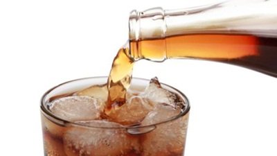 Cola pouring into a glass